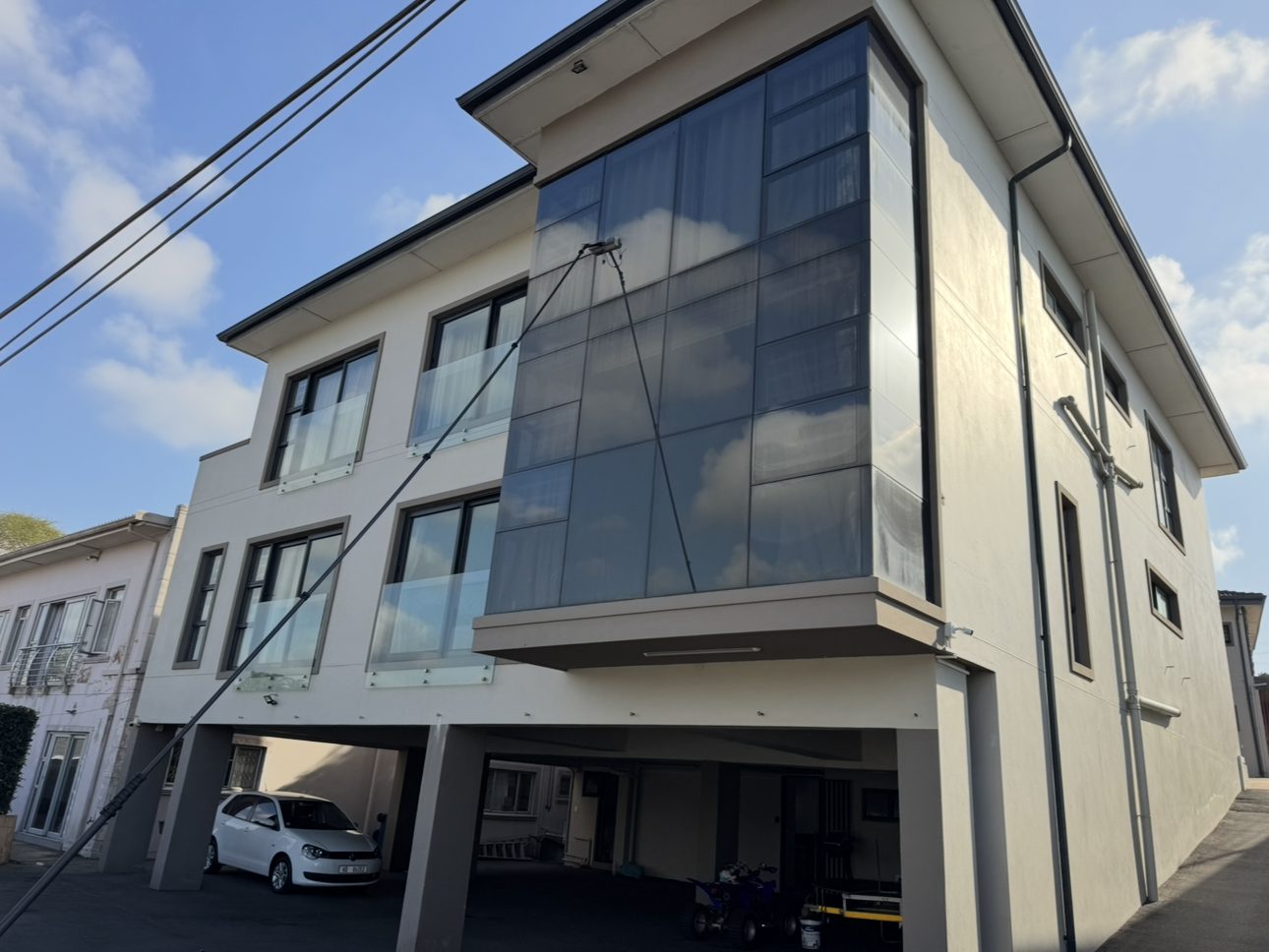 A three storey glazed corner reached on the pole, nobody off the floor.